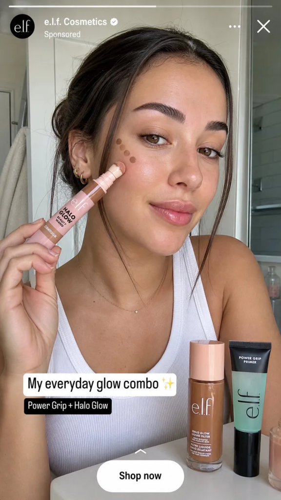e.l.f. Cosmetics Facebook Story ad: creator applying Halo Glow Beauty Wand in bathroom selfie with a caption and Shop now button at bottom.