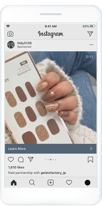 Instagram carousel ad showing a creator's hand wearing brown and gold glitter nail wraps next to the product packaging.