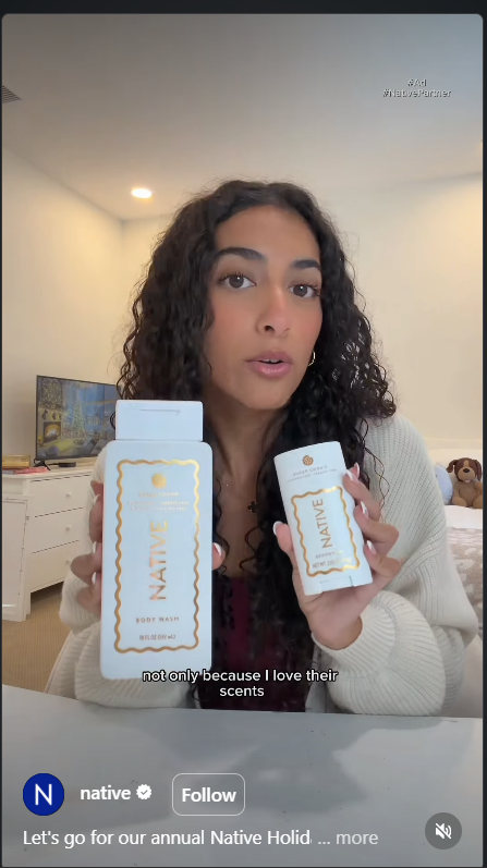 Example of a UGC-style feed ad showing a creator holding two Native products at home.