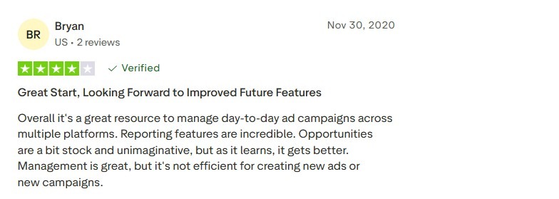 A verified four-star user review of Adzooma praising its reporting and multi-platform ad management features.