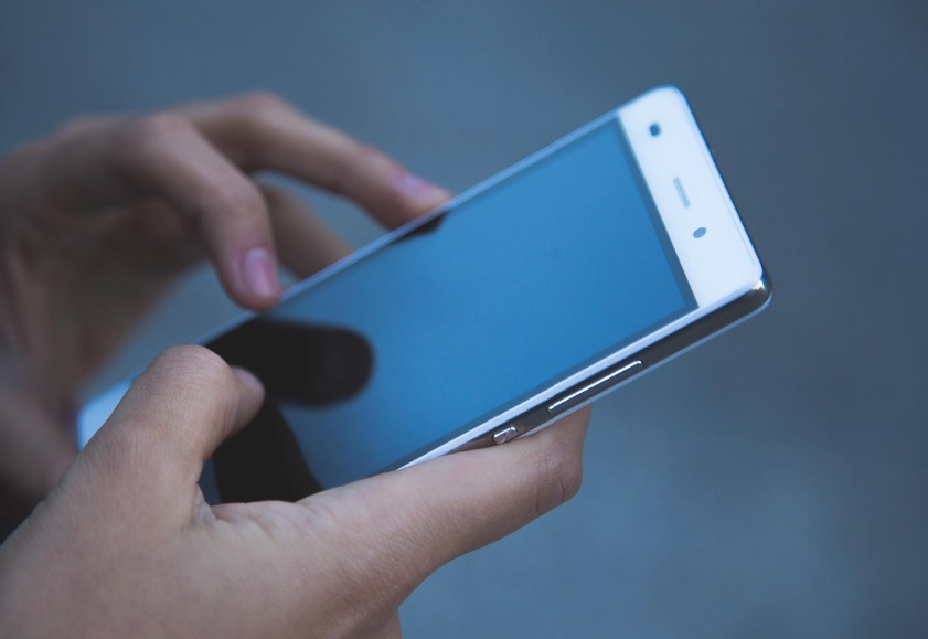 A person scrolling through TikTok on their phone. 