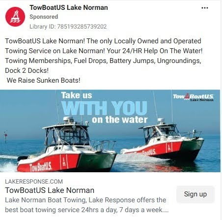 Ad for TowBoatUS Lake Norman showing two red towing boats with text "Take us with you on the water.
