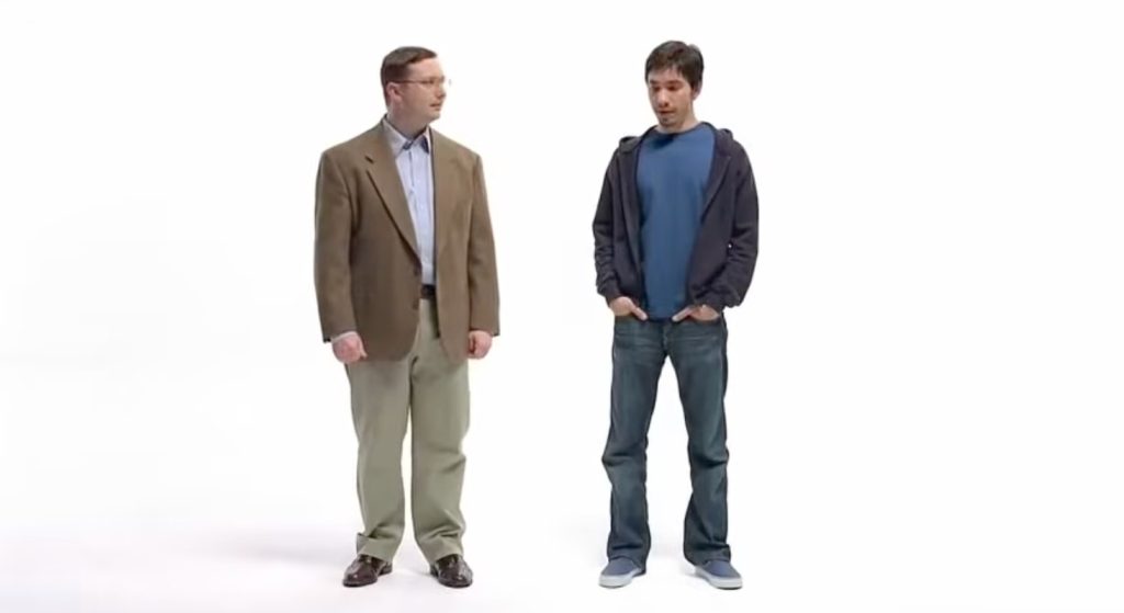 Apple's 2006 "Get a Mac" commercial showing John Hodgman as the suit-wearing PC character on the left and Justin Long as the casual hoodie-wearing Mac character on the right against a white background.