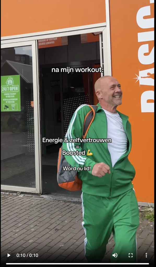 Basic-Fit Shake Surprise TikTok ad: a man in a green tracksuit leaves an orange Basic-Fit gym, with Dutch text reading "after my workout: energy & confidence = boosted, become a member now”.