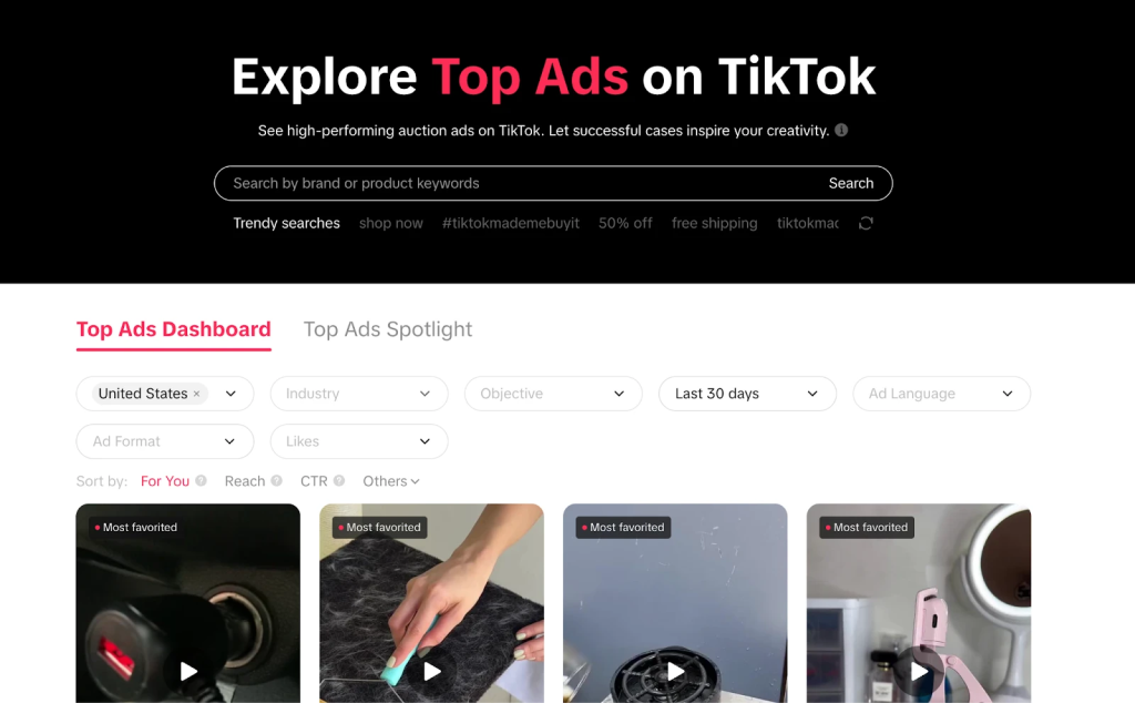 TikTok Creative Center "Explore Top Ads on TikTok" dashboard with filters for region, industry, and objective above a grid of top-performing ad thumbnails.