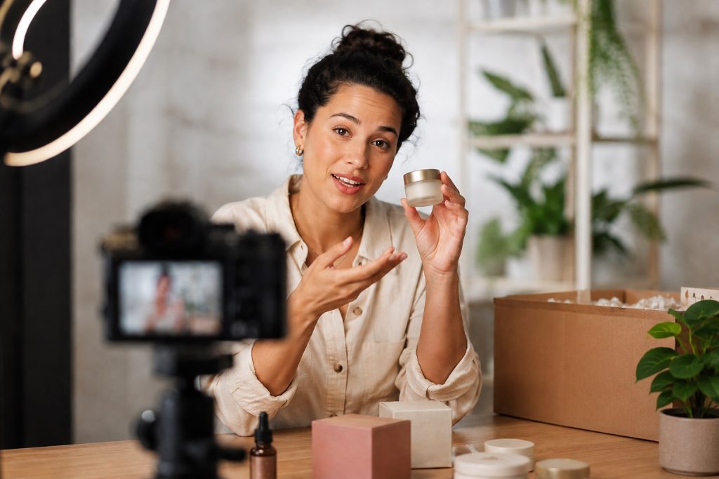A content creator recording a UGC ad for a skincare product. 