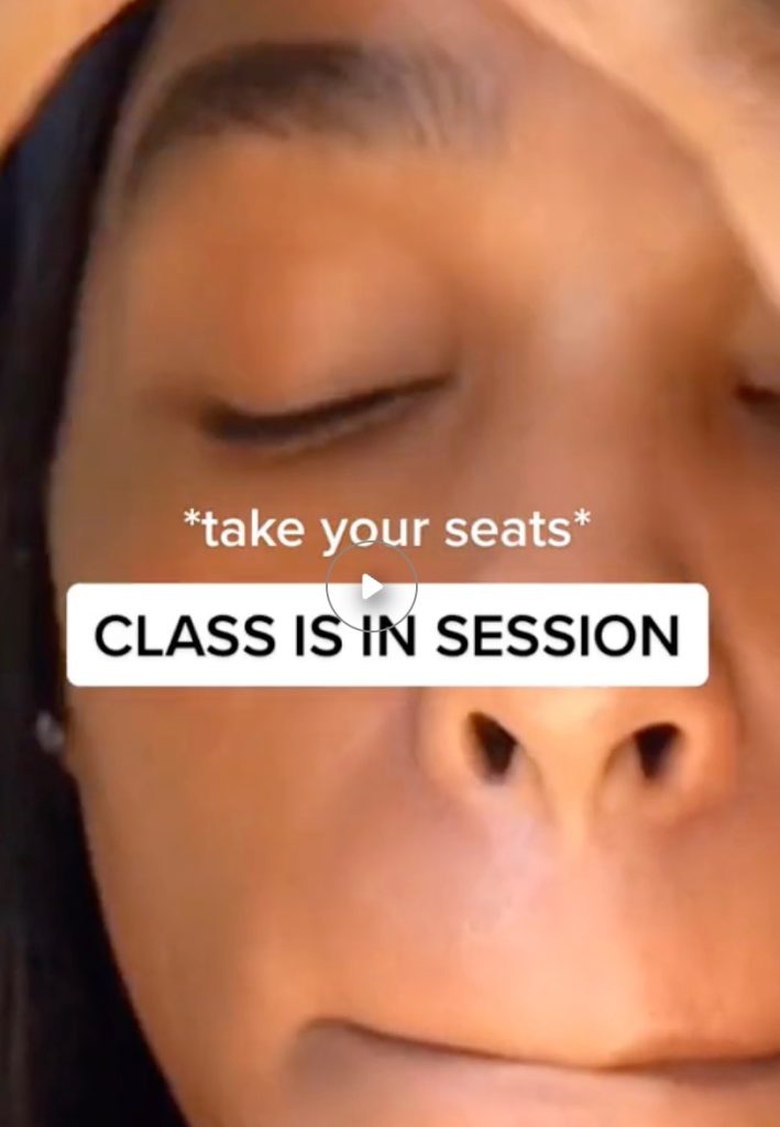 Close-up of a person's face with "Class is in session" text in a TikTok video.