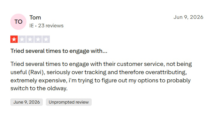 Trustpilot review citing over-tracking, high cost, and frustration with customer service responses.