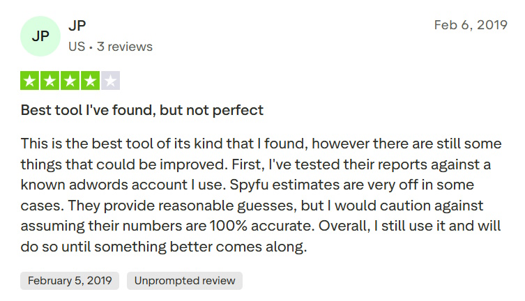 4-star Trustpilot review from JP praising SpyFu while cautioning that some estimates may be inaccurate.