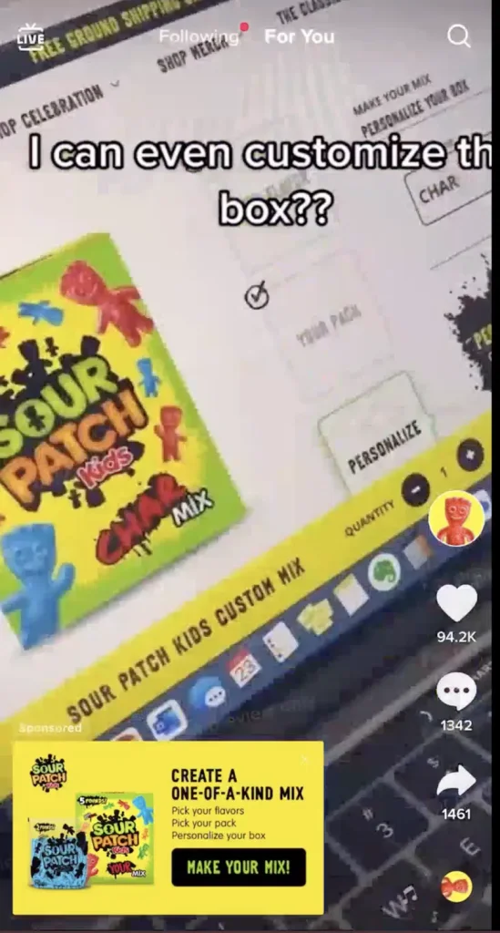 Sour Patch Kids tap-to-reveal Display Card TikTok ad: a "Create a one-of-a-kind mix / Make Your Mix!" card over a custom-box page, with on-screen text "I can even customize the box??"