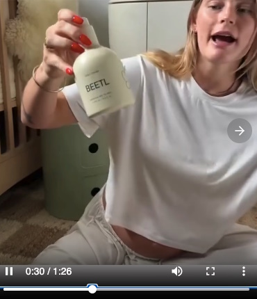Still from a video ad showing a mother reviewing a baby product.