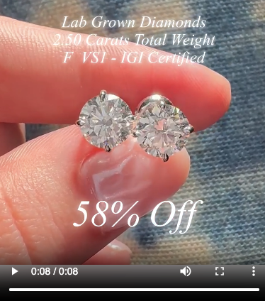 Still from a video showing a close-up of diamond earrings being advertised.